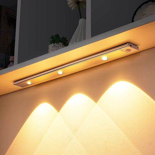 Wireless motion sensor cabinet light illuminating a wall, perfect for adding instant brightness to any space.