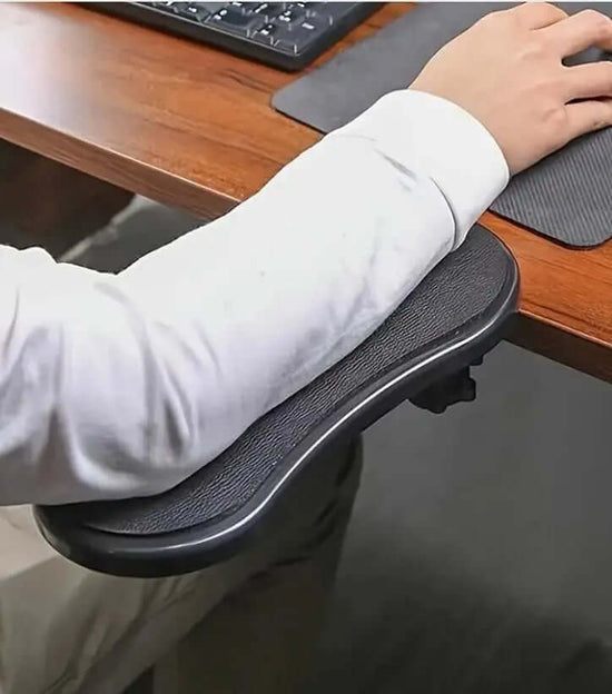 Ergonomic desk arm/wrist rest pad for comfort and support while using a computer at a desk.